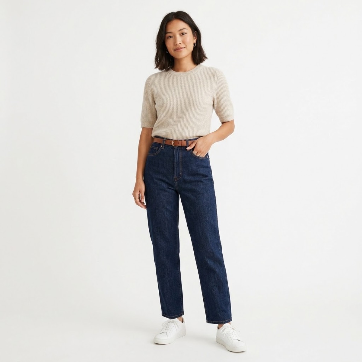 High-rise jeans with full tuck and belt at the natural waist